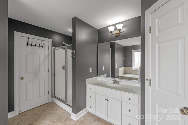 1919 46th Avenue Dr NE Unit 46, Hickory, NC 28601 - bathroom featuring a shower stall, tile patterned flooring, vanity, baseboards, and a chandelier