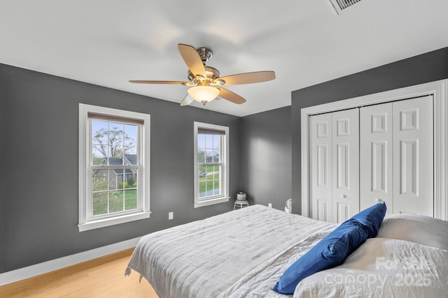 1919 46th Avenue Dr NE Unit 46, Hickory, NC 28601 - bedroom featuring light wood-style floors, a closet, baseboards, and ceiling fan
