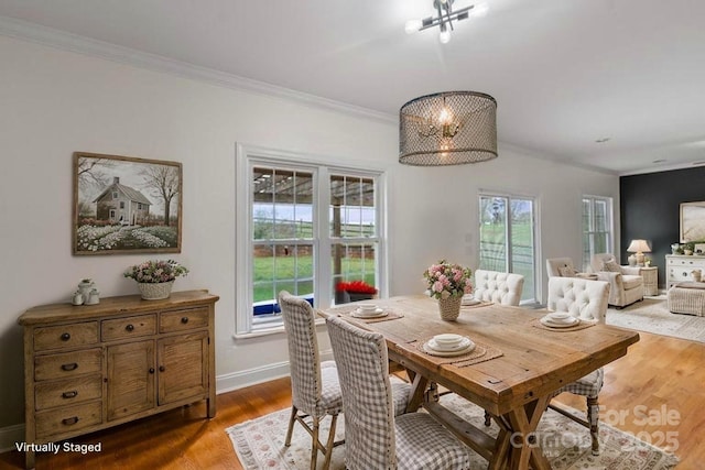 1919 46th Avenue Dr NE Unit 46, Hickory, NC 28601 - dining area featuring ornamental molding, wood finished floors, baseboards, and a chandelier
