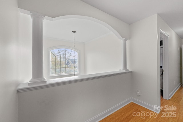 1919 46th Avenue Dr NE Unit 46, Hickory, NC 28601 - corridor featuring decorative columns, light wood finished floors, and baseboards