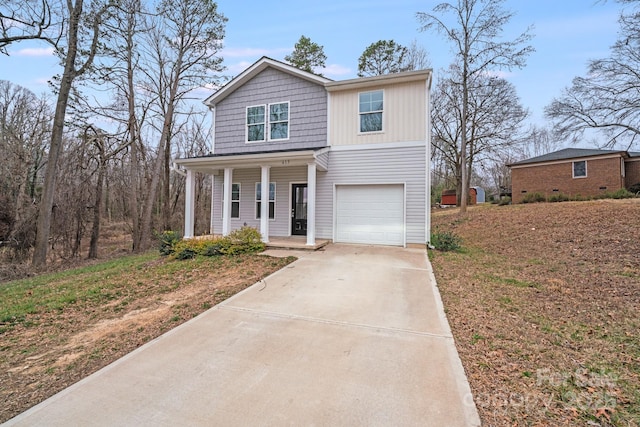 traditional-style house featuring board and batten siding, concrete driveway, covered porch, and an attached garage