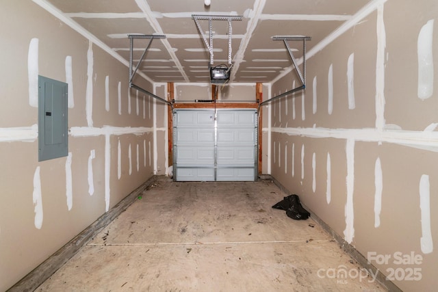 garage featuring electric panel and a garage door opener