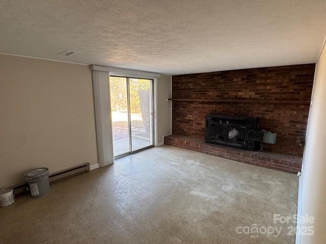 unfurnished living room with a brick fireplace, a baseboard heating unit, and a textured ceiling