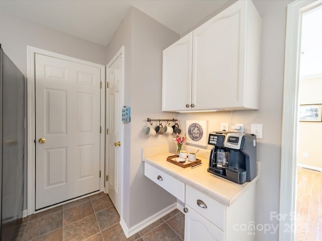 interior space featuring baseboards