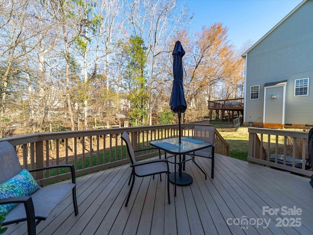 deck featuring outdoor dining area