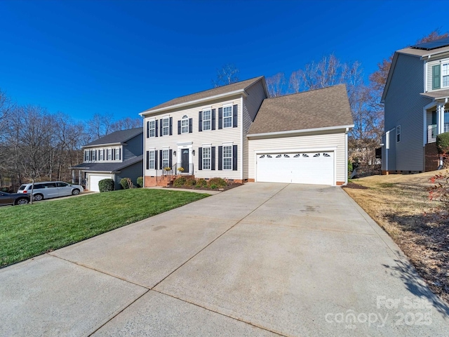 colonial home featuring roof with shingles, crawl space, a garage, driveway, and a front lawn