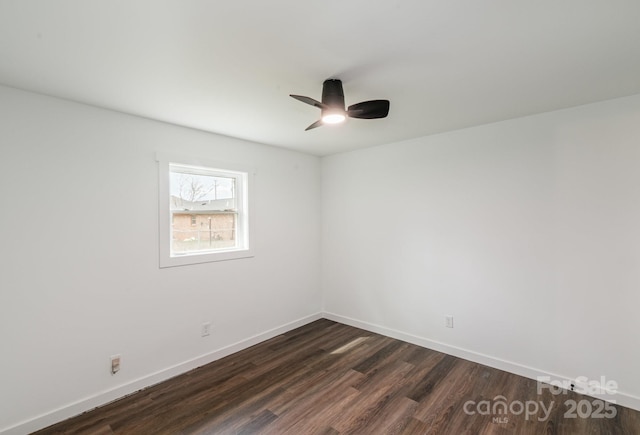 209 Palmer St, Shelby, NC 28150 - spare room with dark wood finished floors, a ceiling fan, and baseboards