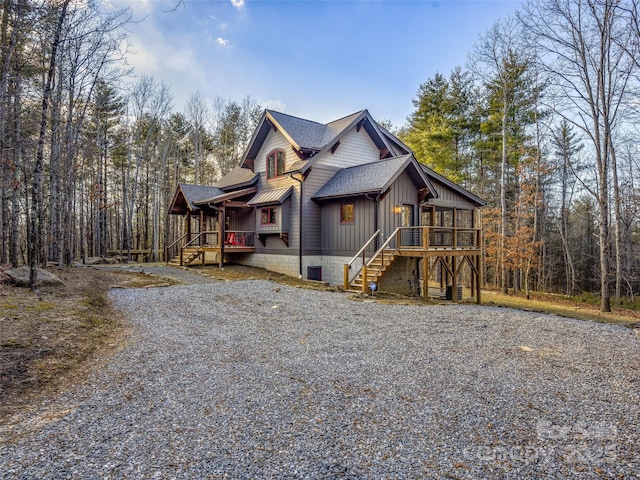 103 Duck Hope Dr, Hendersonville, NC 28739 - view of front of house with a deck, a shingled roof, stairway, and board and batten siding