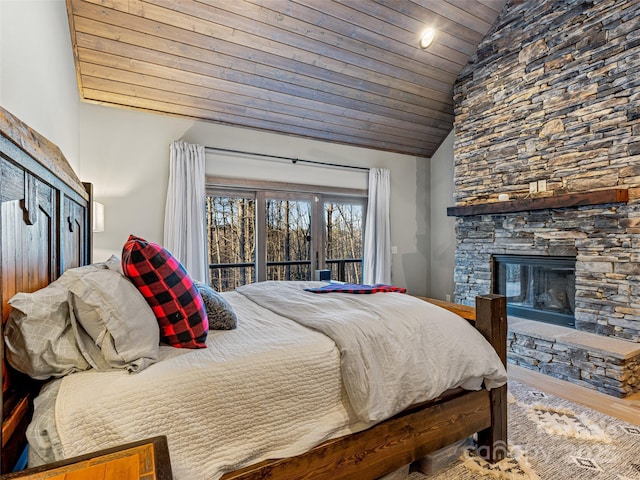 103 Duck Hope Dr, Hendersonville, NC 28739 - bedroom featuring wood ceiling, vaulted ceiling, a stone fireplace, and wood finished floors