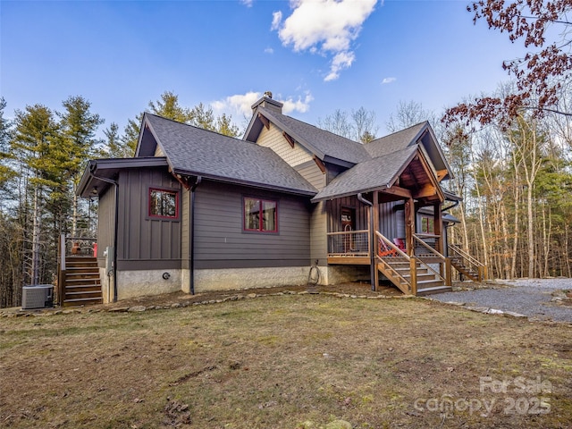 103 Duck Hope Dr, Hendersonville, NC 28739 - chalet / cabin featuring a chimney, roof with shingles, stairs, cooling unit, and board and batten siding
