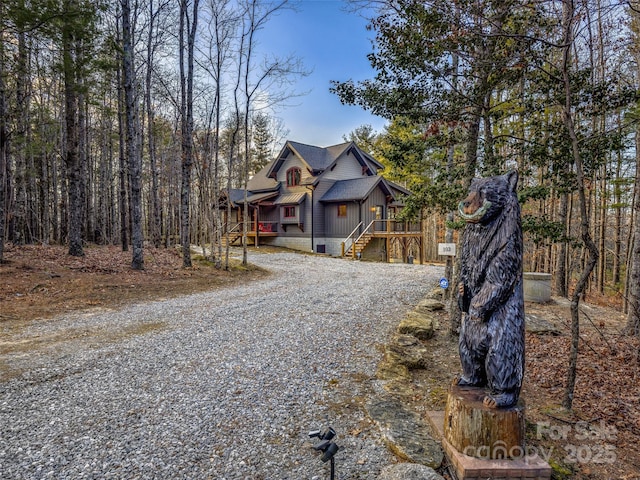 103 Duck Hope Dr, Hendersonville, NC 28739 - chalet / cabin with board and batten siding, roof with shingles, and driveway
