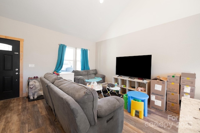 living room with lofted ceiling and wood finished floors