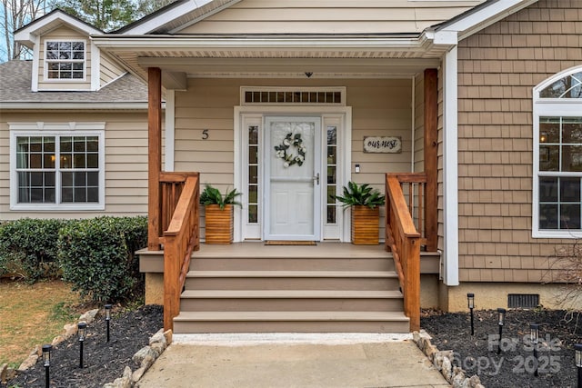 doorway to property with a shingled roof and crawl space