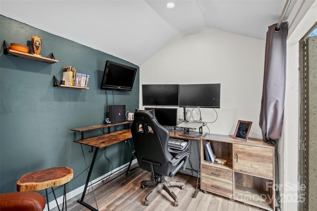 office featuring lofted ceiling and wood finished floors