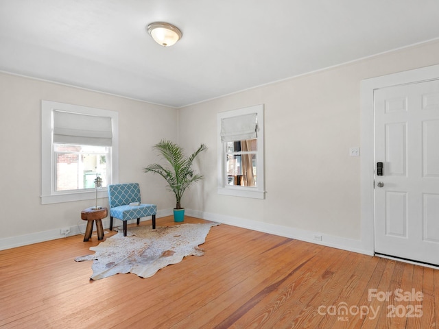 sitting room with wood finished floors and baseboards