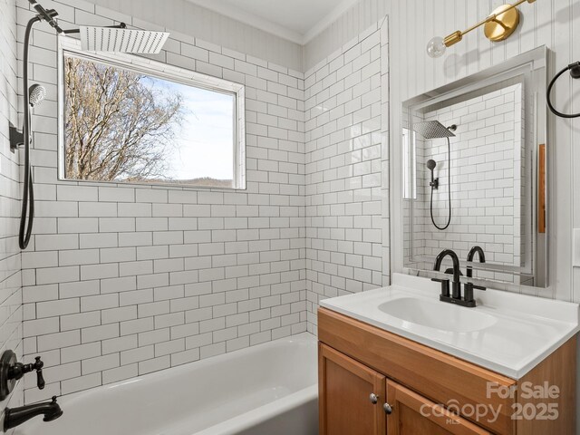 full bathroom featuring crown molding, vanity, and shower / bath combination