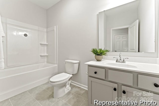 bathroom featuring baseboards, toilet, tile patterned floors, tub / shower combination, and vanity