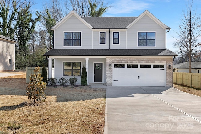 view of front facade featuring a garage, driveway, roof with shingles, fence, and brick siding