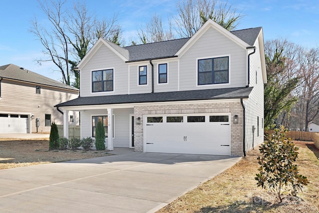 view of front of property with brick siding, driveway, an attached garage, and roof with shingles