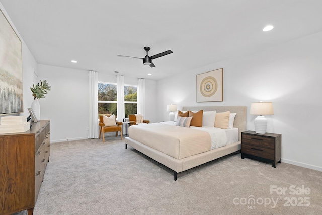 bedroom with recessed lighting, light colored carpet, and baseboards