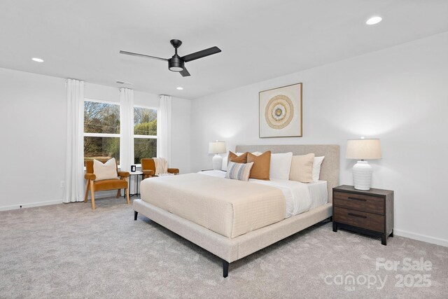 carpeted bedroom with a ceiling fan, recessed lighting, visible vents, and baseboards