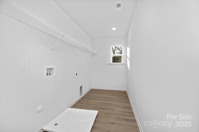 laundry room with laundry area, visible vents, gas dryer hookup, wood finished floors, and hookup for a washing machine