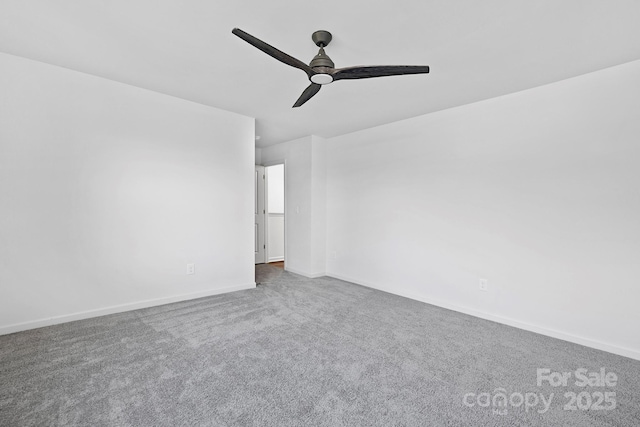 empty room featuring carpet flooring, ceiling fan, and baseboards