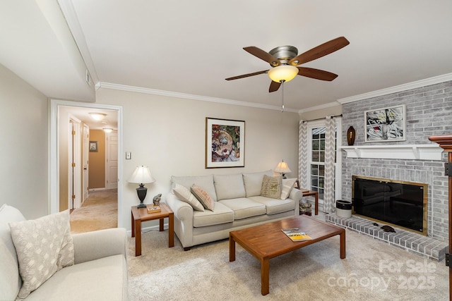 living area with light carpet, a brick fireplace, ceiling fan, and crown molding