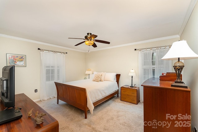 bedroom with a ceiling fan, light colored carpet, and ornamental molding