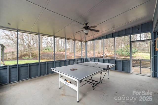 unfurnished sunroom featuring lofted ceiling and ceiling fan