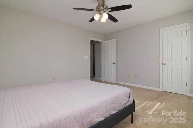 bedroom with carpet floors, a ceiling fan, and baseboards