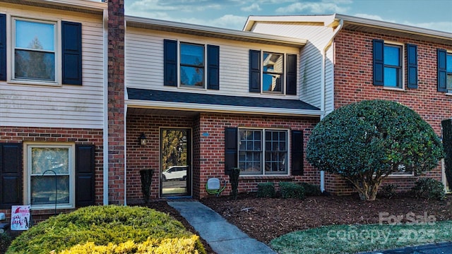 view of front of home with brick siding