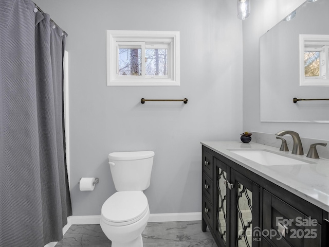 232 Stonebrook Dr, Hendersonville, NC 28791 - full bathroom with marble look tile flooring, vanity, baseboards, and toilet