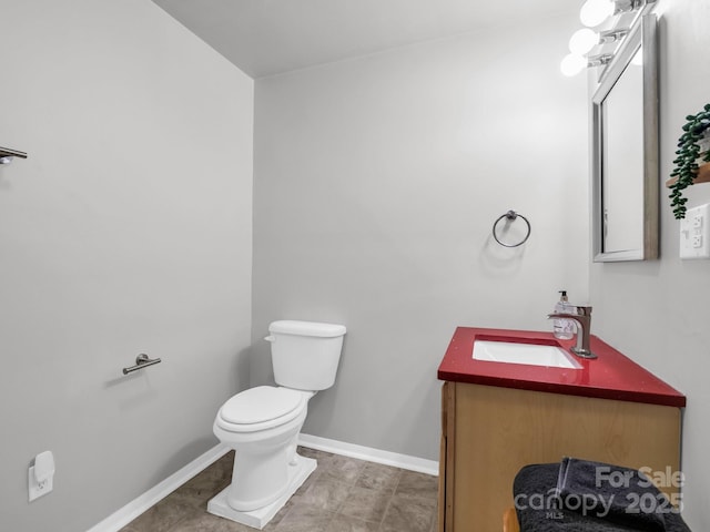 232 Stonebrook Dr, Hendersonville, NC 28791 - half bathroom with vanity, toilet, and baseboards