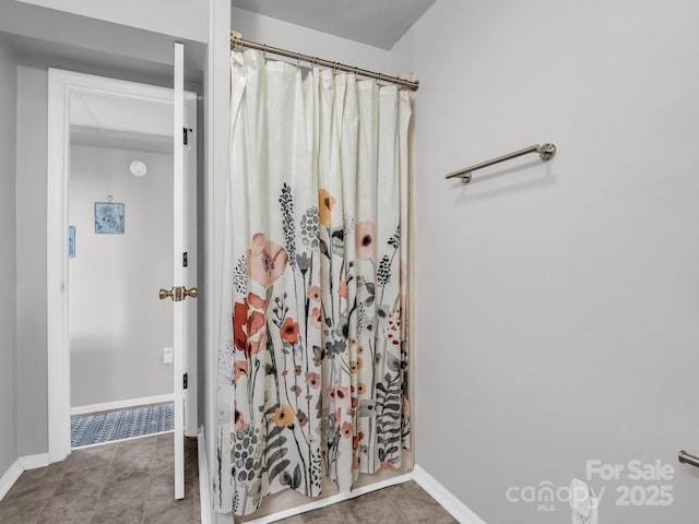 232 Stonebrook Dr, Hendersonville, NC 28791 - bathroom with baseboards and a shower with shower curtain
