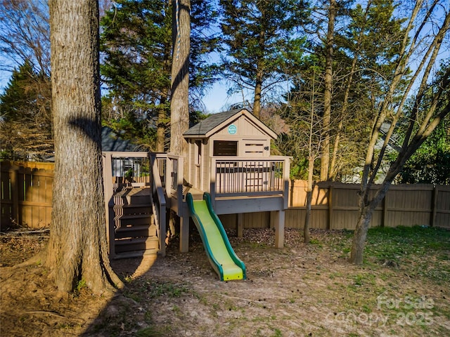 view of jungle gym featuring fence