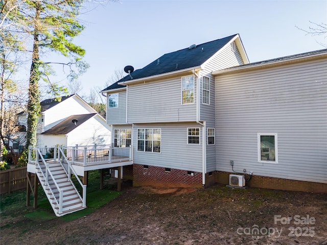 rear view of property featuring central AC unit, crawl space, stairs, fence, and a wooden deck