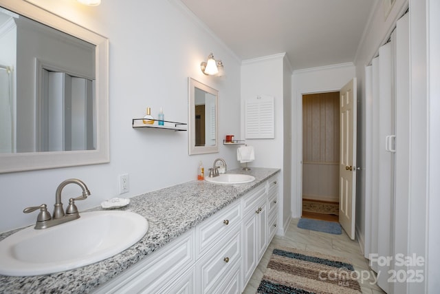 bathroom featuring double vanity, a sink, and crown molding