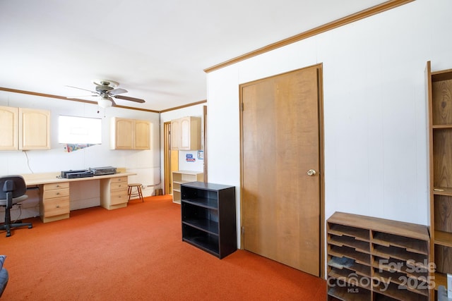 office area featuring ceiling fan, built in study area, light colored carpet, and crown molding