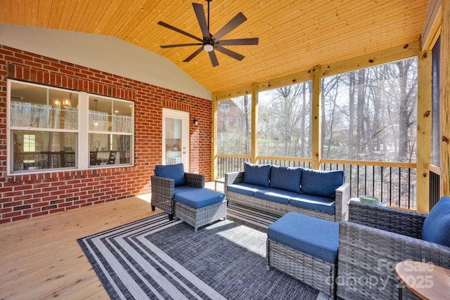 sunroom / solarium featuring wooden ceiling, a healthy amount of sunlight, and vaulted ceiling