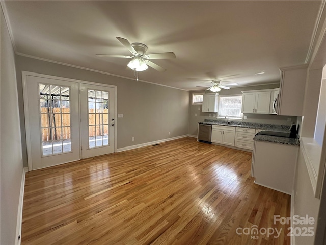 kitchen with ornamental molding, light wood-style floors, white cabinets, a sink, and dishwasher