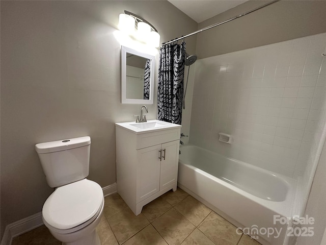 full bath with toilet, vanity, baseboards, tile patterned floors, and shower / bath combo