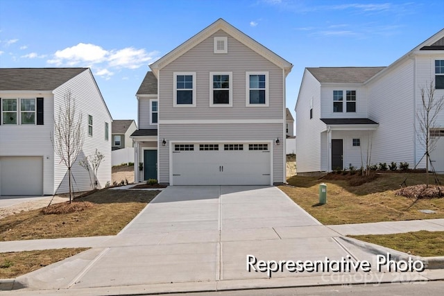 traditional-style house with an attached garage and concrete driveway