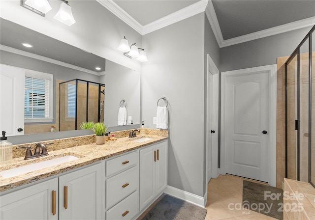 full bathroom with a sink, a stall shower, ornamental molding, and tile patterned flooring