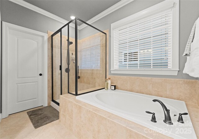 full bath featuring tile patterned floors, a stall shower, a garden tub, and ornamental molding