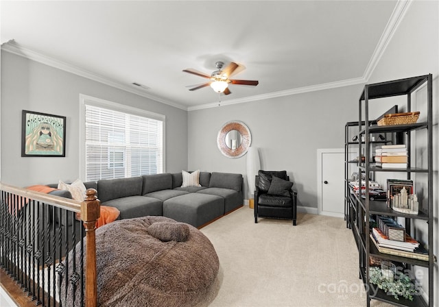 living area featuring a ceiling fan, baseboards, visible vents, ornamental molding, and light colored carpet