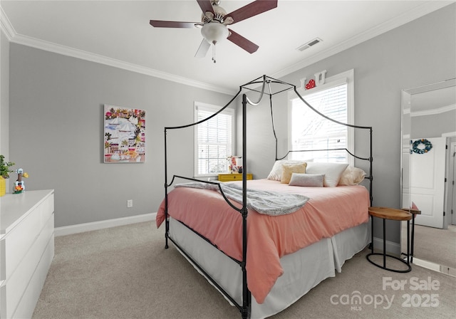 bedroom with visible vents, ornamental molding, baseboards, light colored carpet, and ceiling fan