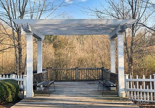 wooden deck featuring a pergola