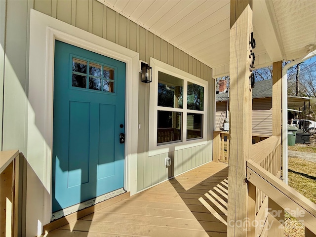 entrance to property featuring a porch