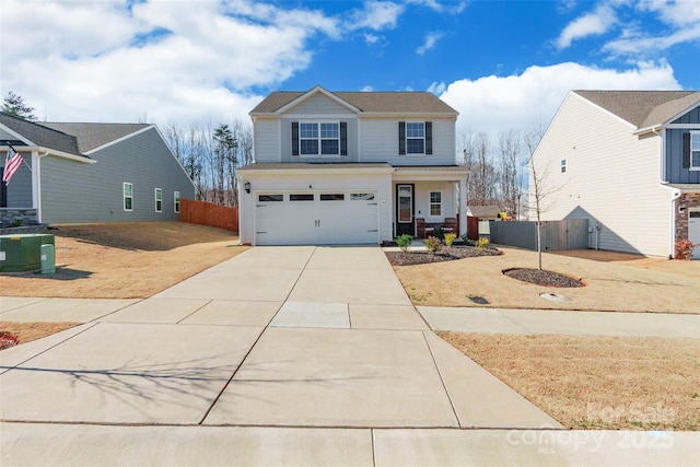 traditional-style home with a garage, concrete driveway, fence, and central AC unit